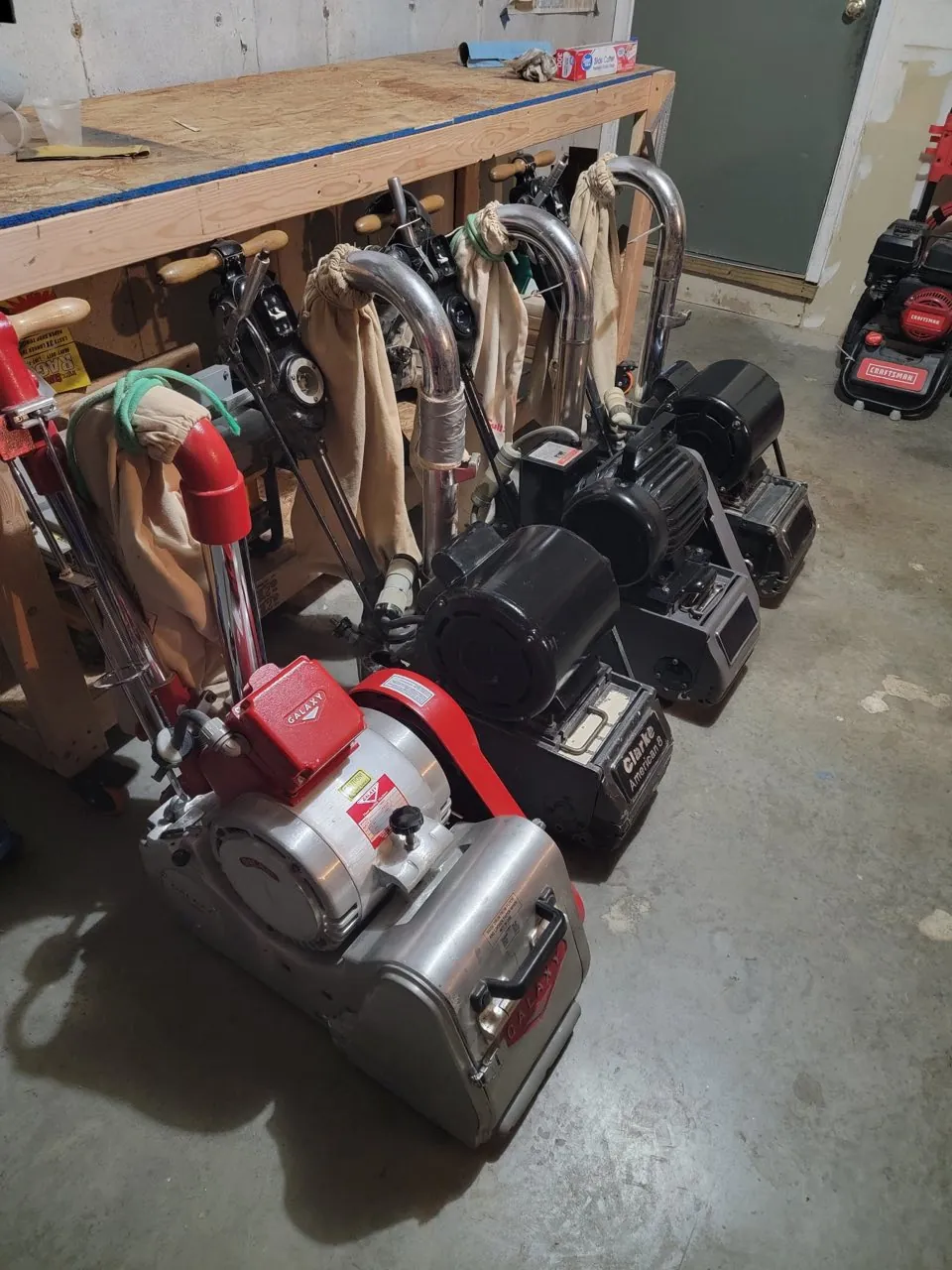 The Russotto fleet of professional drum sanders and edgers lined up in the shop