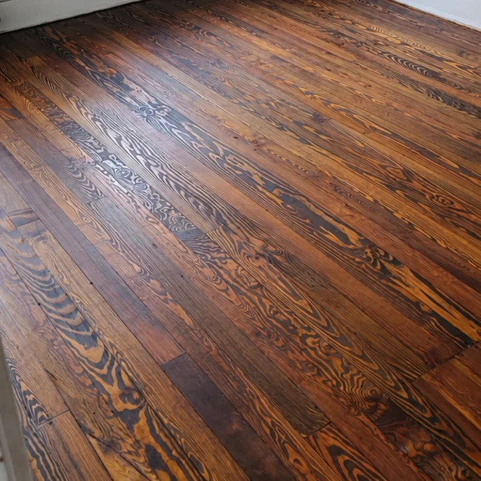 Dark-stained floor restored with the grain brought back to life