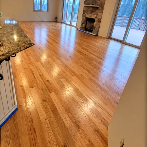 Great room with a stone fireplace, carpet replaced with new hardwood