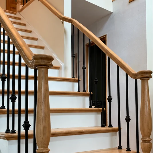 Staircase restored with new treads and iron balusters