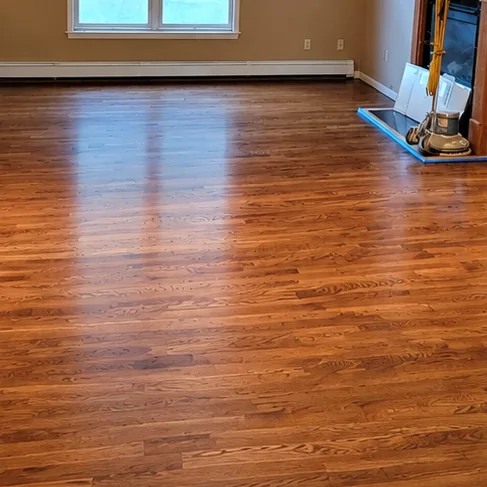 Living room floor restored in a provincial stain